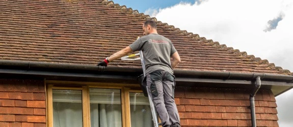 our team cleaning the gutters on a house in Stoke Bishop, Sussex