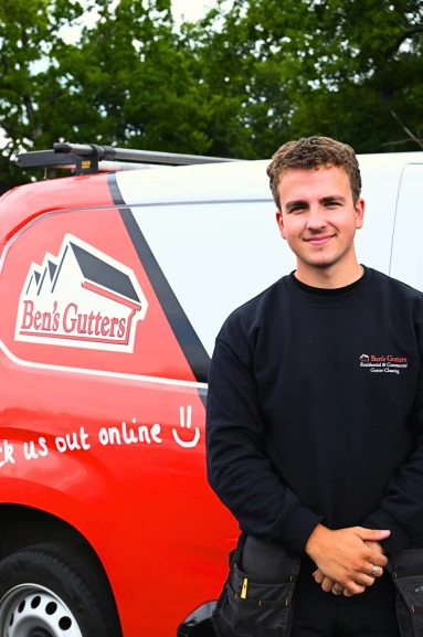 Ben's Gutters Sussex gutter cleaning technician beside branded service van